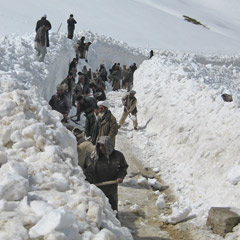 CRS enlists local Afghanis for a snow-clearing effort in Ghor through its cash-for-work program. (Photo courtesy of Scott Braunschweig)