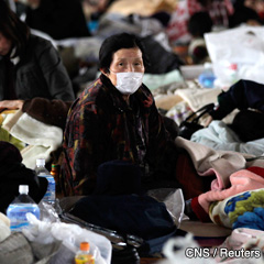 A woman who fled from the vicinity of the Fukushima nuclear power plant sits at an evacuation centre in Kawamata, Japan. (CNS photo/Yuriko Nakao, Reuters) 