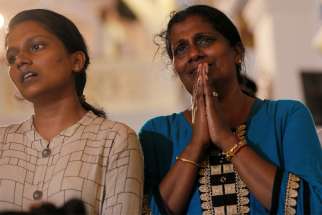 Family members of victims react while praying during the reopening ceremony of St. Anthony&#039;s Shrine in Colombo, Sri Lanka, June 12, 2019, months after it was closed because of an Easter bombing. A top British official said the government would commit itself to a robust defense of persecuted Christians following a new report into their plight.