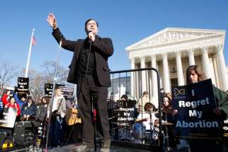 Father Frank Pavone, national director of Priests for Life, speaks in front of the U.S. Supreme Court at the 2009 March For Life in Washington. Pro-life supporters have denounced Father Pavone over a controversial election Facebook Live video he posted.