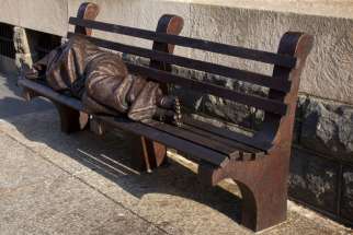 &quot;Homeless Jesus&quot; is pictured in this July 29 photo of the seven-foot-long bronze sculpture that sits in front of a downtown Washington building occupied by Catholic Charities of the Archdiocese of Washington. Pope Francis is expected to pass by the statue Sept. 24 during the Washington-leg of his U.S. visit. 
