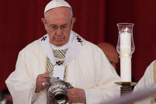 Pope Francis uses incense as he celebrates Mass at the Air Defense Stadium in Cairo April 29.