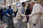 Pope Francis greets a woman during an audience with members of the Missionaries of Africa and the Missionaries of Our Lady of Africa at the Vatican Feb. 8, 2019. 