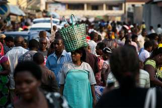  People walk through a market in Bujumbura, Burundi, in this 2015 file photo. Catholic bishops there have criticized an upcoming referendum on constitutional reform that would allow President Pierre Nkurunziza to remain in office till 2034.
