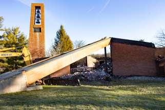 The bell tower of Most Blessed Sacrament Church in Franklin Lakes, N.J., is seen standing Dec. 12, 2019, after a fire destroyed the rest of the church the previous morning. One person suspected of arson is in custody, officials said. The structure was gutted by the flames, and as the news spread through the small town, neighbors, some of whom have been a part of the congregation for decades, flocked to the scene.