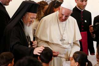 Orthodox Ecumenical Patriarch Bartholomew of Constantinople and Pope Francis are pictured during an encounter with refugees at the Moria refugee camp on the island of Lesbos, Greece, April 16, 2016. 