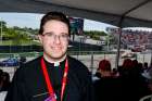 Fr. Jeff Calia at the Honda Indy in Toronto. The American priest is one of a half dozen priests who minister to drivers, crew and event staff on the IndyCar circuit.