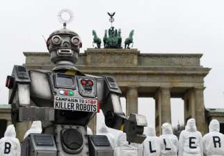 Activists from the Campaign to Stop Killer Robots, a coalition of nongovernmental organizations opposing lethal autonomous weapons, protest at the Brandenburg Gate in Berlin March, 21, 2019.