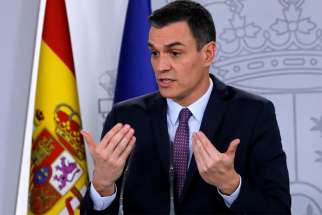 Spanish Prime Minister Pedro Sanchez gestures at a news conference after the first Cabinet meeting at Moncloa Palace in Madrid Jan. 14, 2020.