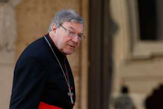 Australian Cardinal George Pell, prefect of the Vatican Secretariat for the Economy, arrives for the extraordinary Synod of Bishops on the family at the Vatican.