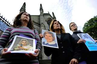 Members of the U.S.-based Survivors Network of those Abused by Priests, or SNAP hold portraits of themselves as youths as they address the media during a protest outside St. Mary&#039;s Catholic Cathedral in Edinburgh, Scotland in this picture dated Sept. 15 2010.  The Survivors Network of those Abused by Priests, which represents 18,000 victims, said that hundreds of children and adults were still being “sexually violated, tortured and assaulted” by Catholic priests.