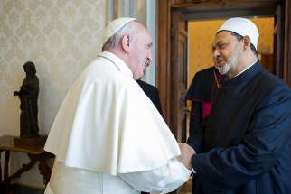 Pope Francis greets Ahmad el-Tayeb, grand imam of Egypt&#039;s al-Azhar mosque and university, during a private meeting at the Vatican May 23. The Vatican and Al-Azhar is teaming up to combat religious justification for violence.