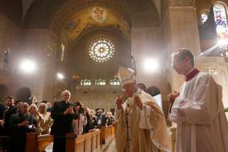 Pope Francis walks through the Basilica of the National Shrine of the Immaculate Conception as he arrives to celebrate Mass and the canonization of Junipero Serra Sept. 23 in Washington. 