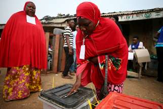A woman casts her vote during Nigeria&#039;s governorship and state assembly election in Karu, Nigeria, March 9, 2019. 