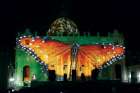 A butterfly is seen in a light show on the facade and dome of St. Peter’s Basilica at the Vatican Dec. 8. The show was sponsored by a coalition of production companies and charitable foundations to raise awareness about climate change. With nations like Canada signing the Paris Accord on climate change, the time for hard work to achieve its goals is only beginning.