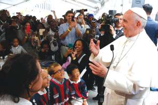 Pope Francis meets people involved with St. Maria’s Meals Program of Catholic Charities in Washington Sept. 24.