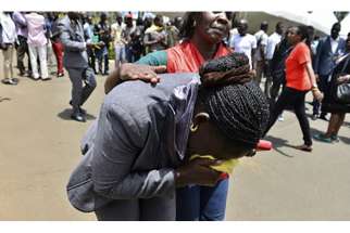 A Red Cross worker comforts a mourner as bodies of the students killed in a Thursday (April 2) attack, arrive at the Chiromo Mortuary in Nairobi. At least 147 people died in an assault by Somali militants on a Kenyan university, as anger grew among local residents over what they say was a government failure to prevent bloodshed.