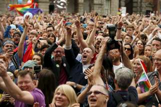 People in Dublin react as Ireland voted in favour of allowing same-sex marriage May 23.