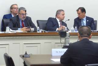 Bob Fu, founder of ChinaAid, addresses Rep. Chris Smith, R-N.J., chairman of the House Foreign Affairs&#039; Subcommittee on Africa, Global Health, Global Human Rights and International Organizations, and other members of the subcommittee Sept. 27. HU&#039;s comments concerned the Chinese government&#039;s persecution of Christians and adherents of other faiths. 