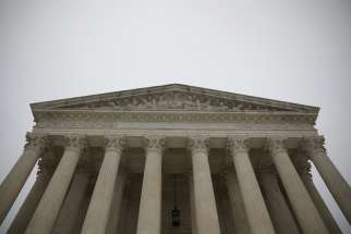 Rain falls on the U.S. Supreme Court in Washington Dec. 14, 2020.