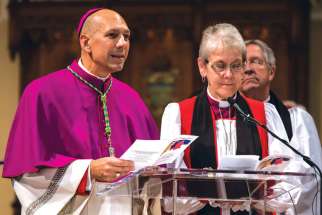 Saskatoon Bishop Don Bolen, left, presides with Anglican Bishop Linda Nicholls at a Nov. 9 ecumenical celebration of the 50th anniversary of the 1964 Decree on Ecumenism from the Second Vatican Council.