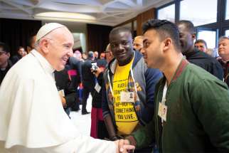 Pope Francis greets a youth delegate in 2018 before a session of the Synod of Bishops on young people, the faith and vocational discernment at the Vatican.
