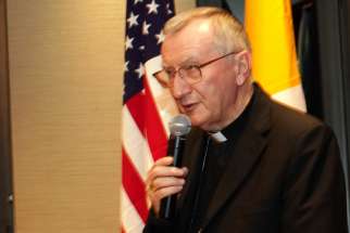 Cardinal Pietro Parolin, Vatican secretary of state, speaks during a Pro Pontifice Dinner at Jesuit-run Fordham University in New York City Sept. 27, 2019. To those who ask why the Catholic Church seems to be &quot;obsessed&quot; with the poor, Cardinal Parolin said, &quot;The answer is simple. Because this is who we are.&quot;