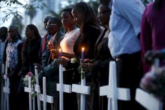People attend a memorial vigil in Nairobi, Kenya, April 7, for the 147 people killed in an attack on Garissa University College. Kenyan bishops are urging the government to step up security and for citizens to remain united after al-Shabab militants atta cked the college campus April 2. 