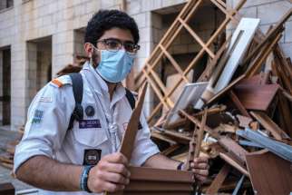 A member of the Maronite Scouts is pictured in an undated photo helping cleanup following the Aug. 4 blast in Beirut’s port area.