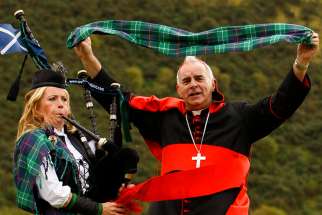 Cardinal Keith O&#039;Brien of St. Andrews and Edinburgh, Scotland, unveils a limited edition papal visit tartan in 2010 in Edinburgh. Cardinal O&#039;Brien, who resigned five years ago after admitting to sexual misconduct, died early March 19 at the age of 80. 