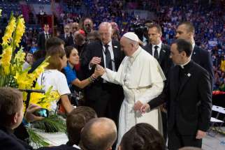 Pope Francis thanks World Youth Day volunteers gathered at the Tauron Arena July 31 in Krakow, Poland.