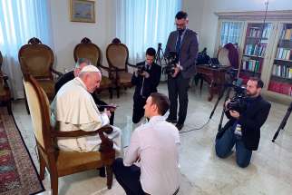 Sebastian Gomes chats with Pope Francis prior to shooting a scene of The Francis Impact at the Vatican. 