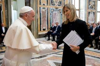 Pope Francis greets Simona Agnes, who presides over the Biagio Agnes Prize, which honors professional journalism. He praised a delegation for promoting reporting that puts the truth “before personal interests or the interests of corporations.”