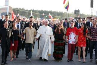 Pope Francis walks with World Youth Day pilgrims July 30, 2016. The upcoming Synod of Bishops&#039; focus is on youth.