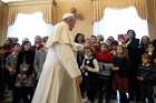 Pope Francis greets representatives of the children and teens section of Italy&#039;s Catholic Action. Meeting the young people at the Vatican Dec. 20, the pope asked them to share their faith with their peers, being especially attentive to children who seem lonely or mistreated. 