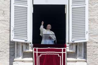 Pope Francis leads the &quot;Regina Coeli&quot; prayer from the window of his studio overlooking St. Peter&#039;s Square at the Vatican May 21.