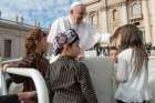 Children join Pope Francis in the popemobile during his general audience in St. Peter&#039;s Square at the Vatican Sept. 25, 2019.