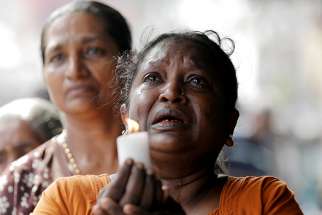 A woman weeps during a memorial service for victims in Colombo, Sri Lanka, April 23, 2019, two days after a string of suicide bomb attacks on churches and luxury hotels across the island. 