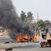 Debris blocking a road burns after a bombing at St. Finbar Catholic Church in the Rayfield suburb of the Nigerian city of Jos March 11. The bomb detonated as worshippers attended the final Mass of the day, killing at least 10 people at the church and in retaliatory violence. 