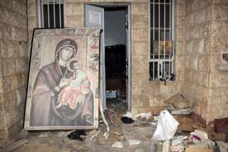 A painting of Mary and the Christ Child is is seen in 2014 at the damaged St. Thecla Orthodox monastery in the predominantly Christian town of Maaloula, Syria. Russia&#039;s Catholic Church has launched a joint project with Russian Orthodox leaders to rebuild churches and monasteries destroyed during the war in Syria.