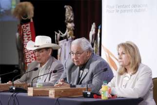 Chief Wilton Littlechild, Justice Murray Sinclair and Marie Wilson, members of the Truth and Reconciliation Commission, take part in a 2015 press conference in Ottawa.