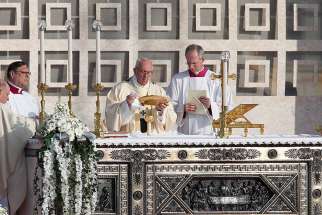 Pope Francis celebrates the Eucharist during Mass at Monza Park near Milan March 25.