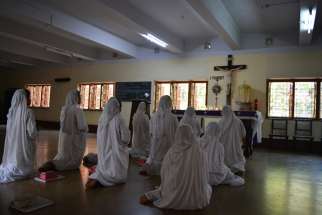 Nuns pray in Kolkata, India, Aug. 4. Although the Sept. 4 canonization of Blessed Teresa is in Rome, special festivities to honor her will continue in Kolkata until Christmas.