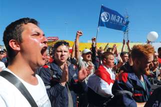 Belarusians protest presidential election results during an opposition demonstration near a plant of the heavy off-road vehicles manufacturer MZT in Minsk, Belarus, Aug. 17. It’s widely believed Svetlana Tikhanovskaya won the disputed election before being forced into exile.