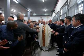 Pope Francis greets inmates and guards as he arrives to celebrate the Mass of Lord&#039;s Supper April 18, 2019, at Velletri Correctional Facility, 36 miles south of Rome. 