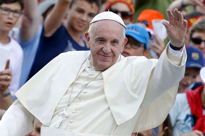 Pope Francis waves as he arrives to attend an audience with some 9,000 altar servers in St. Peter&#039;s Square at the Vatican Aug. 4.