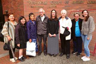 Mary Wagner, centre, was joined by her father Frank and other supporters after her sentencing hearing for being found guilty of mischief and trespassing at an abortion clinic in Vancouver.