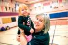 Linda Ward gives little Alessia Mussol a boost at the end of another Monday night of Special Olympics activities in the gym of St. Brigid’s Catholic School.