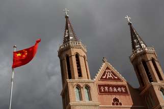 he Chinese national flag flies in front of a Catholic church in the village of Huangtugang, Hebei province, China, Sept. 30, 2018.