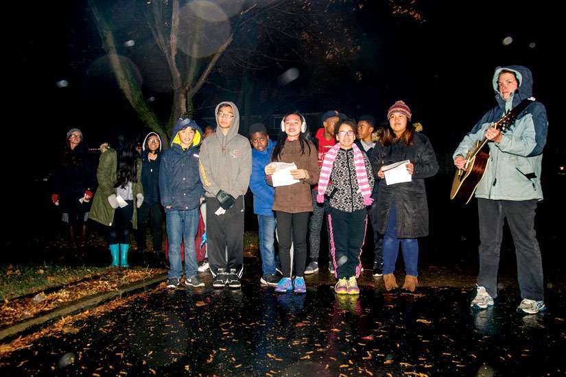 Students from Toronto’s Holy Spirit Catholic School braved the elements to deliver Christmas carols in their neighbourhood Dec. 4.
